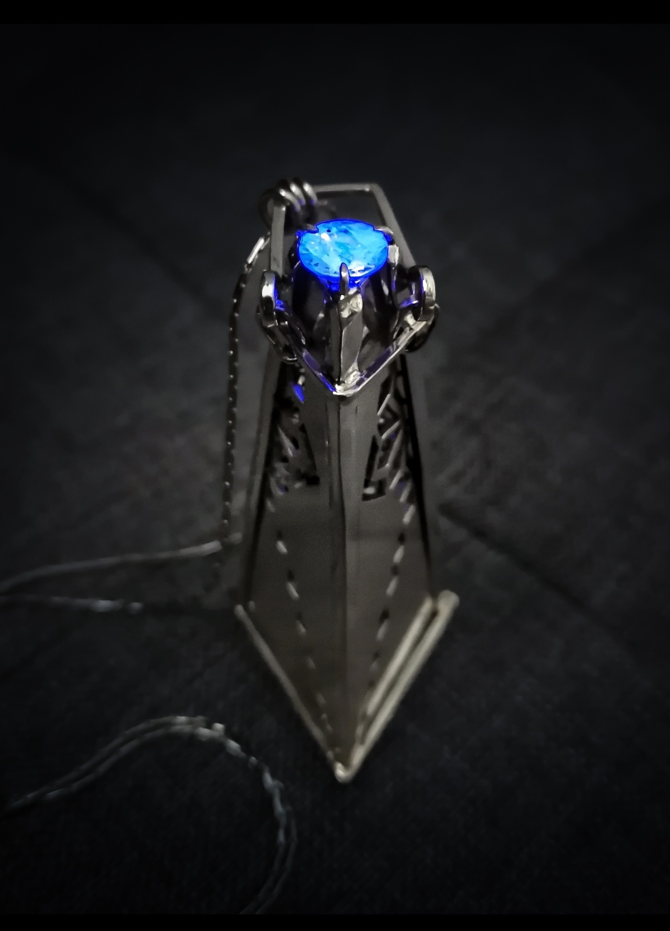 Kaleidoscope pendant with blue gem