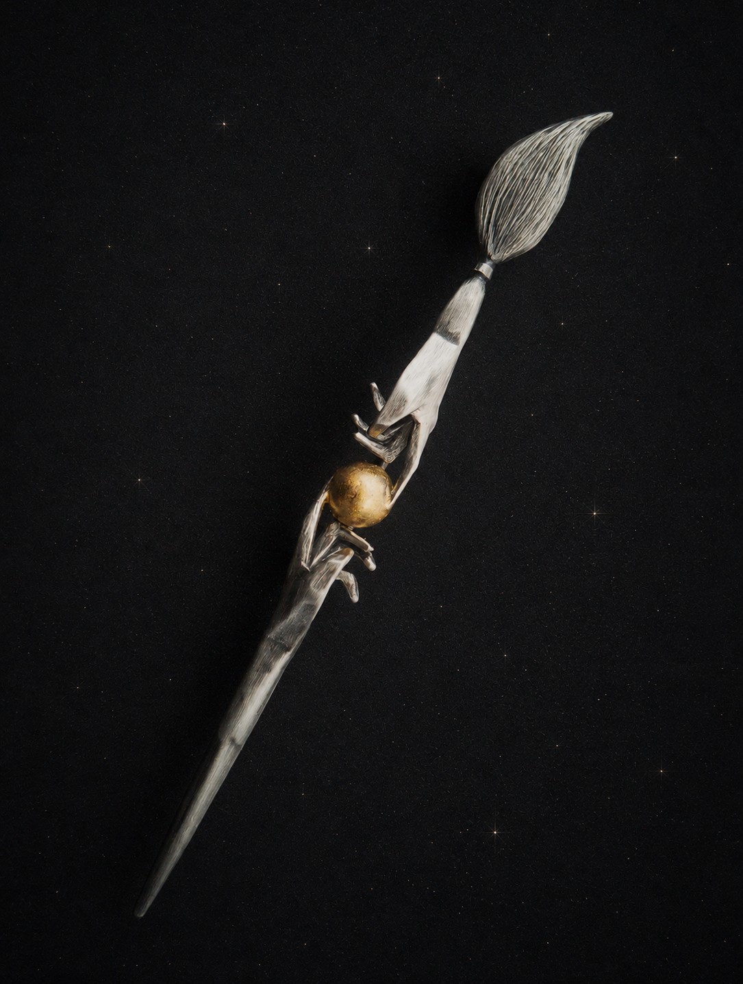 Commission paintbrush brooch on starry background