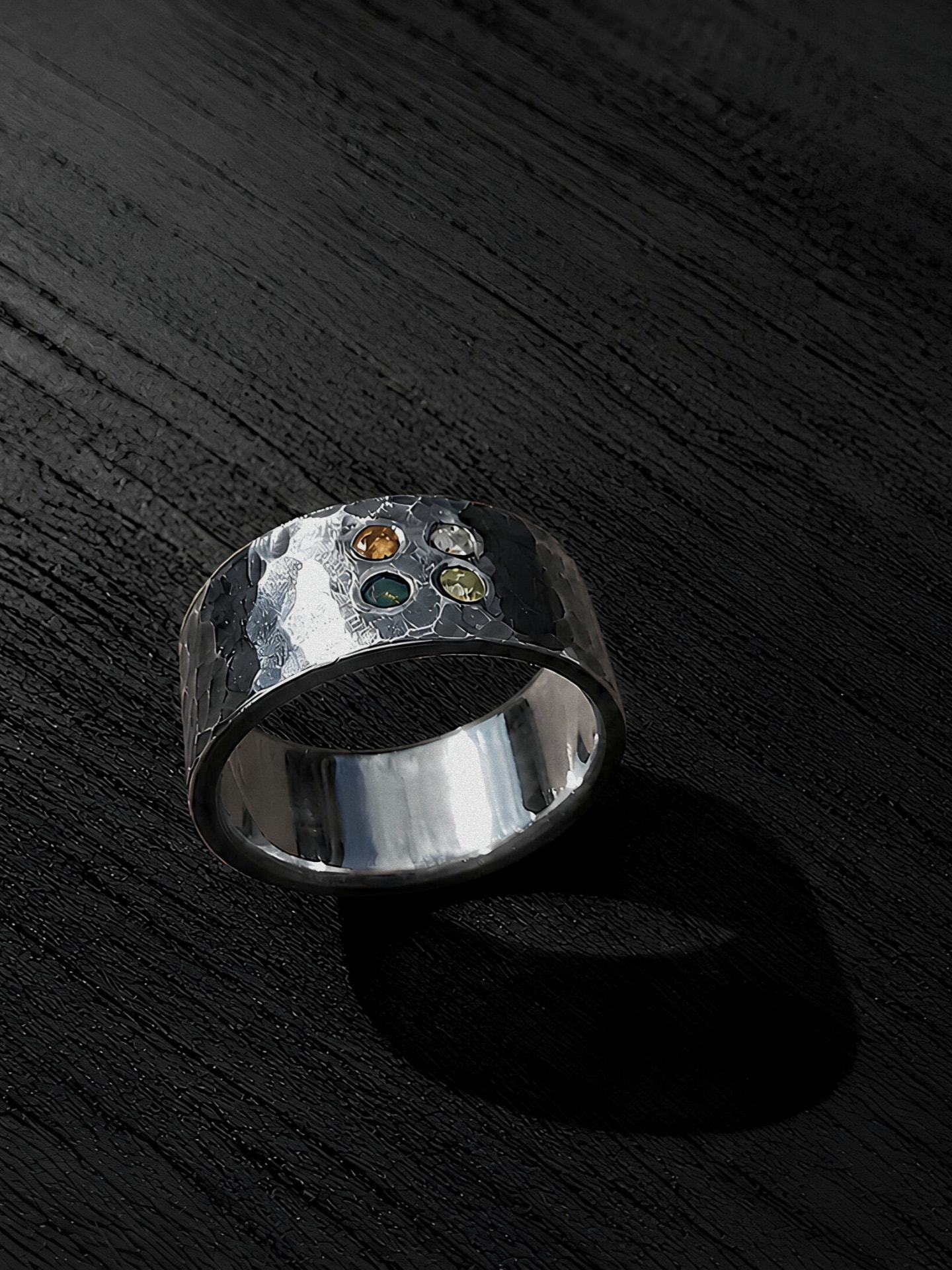 The Zenith ring, front view on dark wood